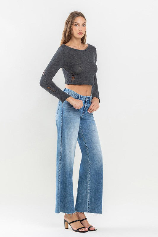 Jeans anchos con dobladillo sin rematar y talle medio
