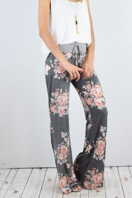 Pantalones anchos con estampado floral y cordón