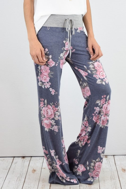 Pantalones anchos con estampado floral y cordón