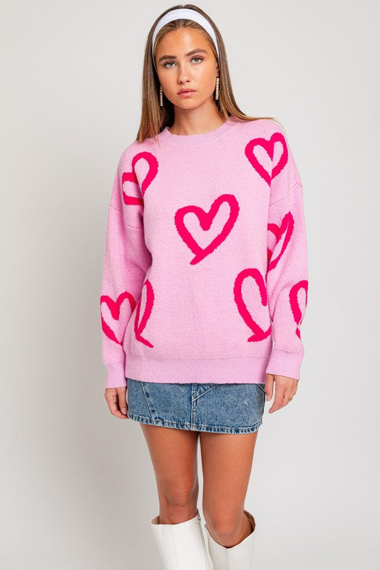 Suéter con estampado de corazones y cuello redondo de manga larga
