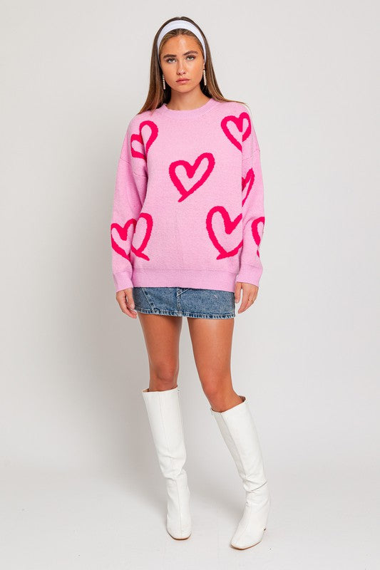 Suéter con estampado de corazones y cuello redondo de manga larga