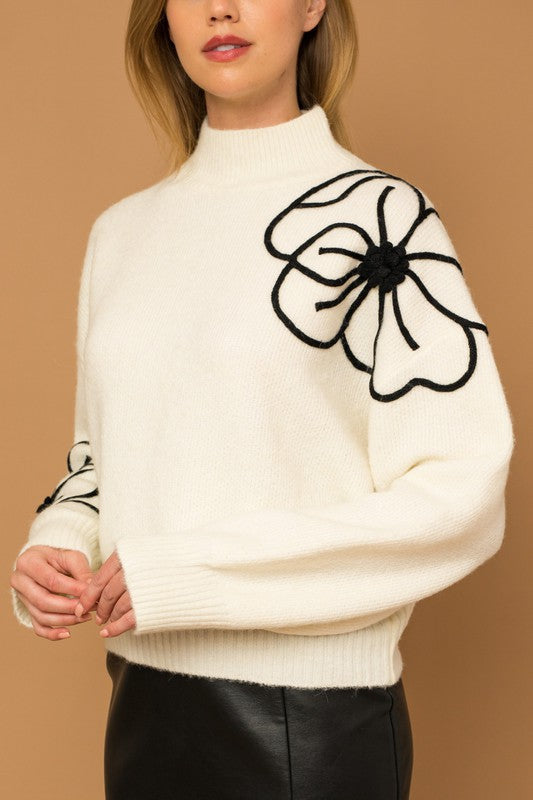 Suéter con cuello simulado y bordado de flores