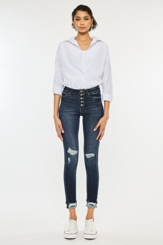 Jeans ajustados con puños y talle alto con botones en el tobillo
