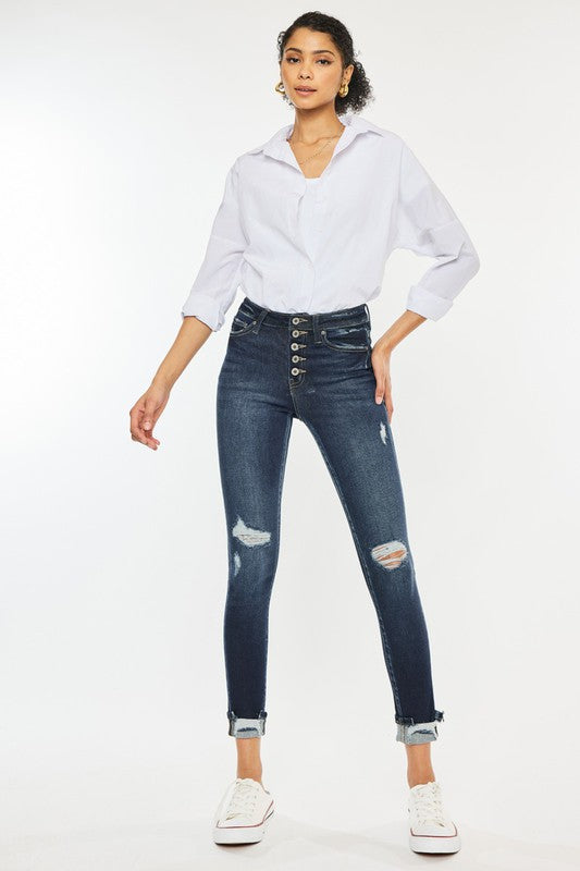 Jeans ajustados con puños y talle alto con botones en el tobillo