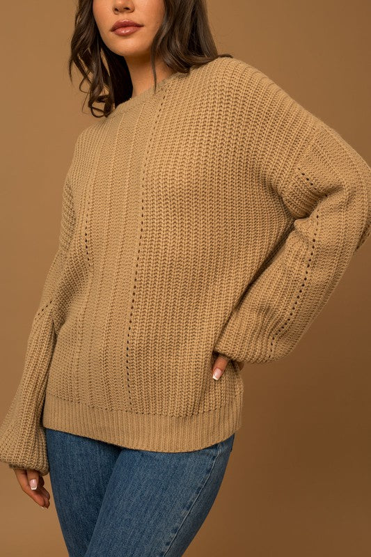 Suéter trenzado con mangas globo