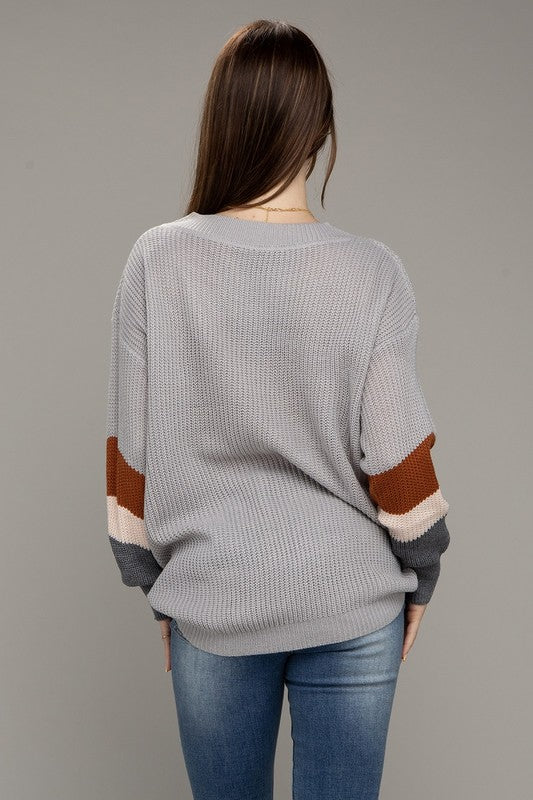 Suéter con hombros caídos y bloques de color